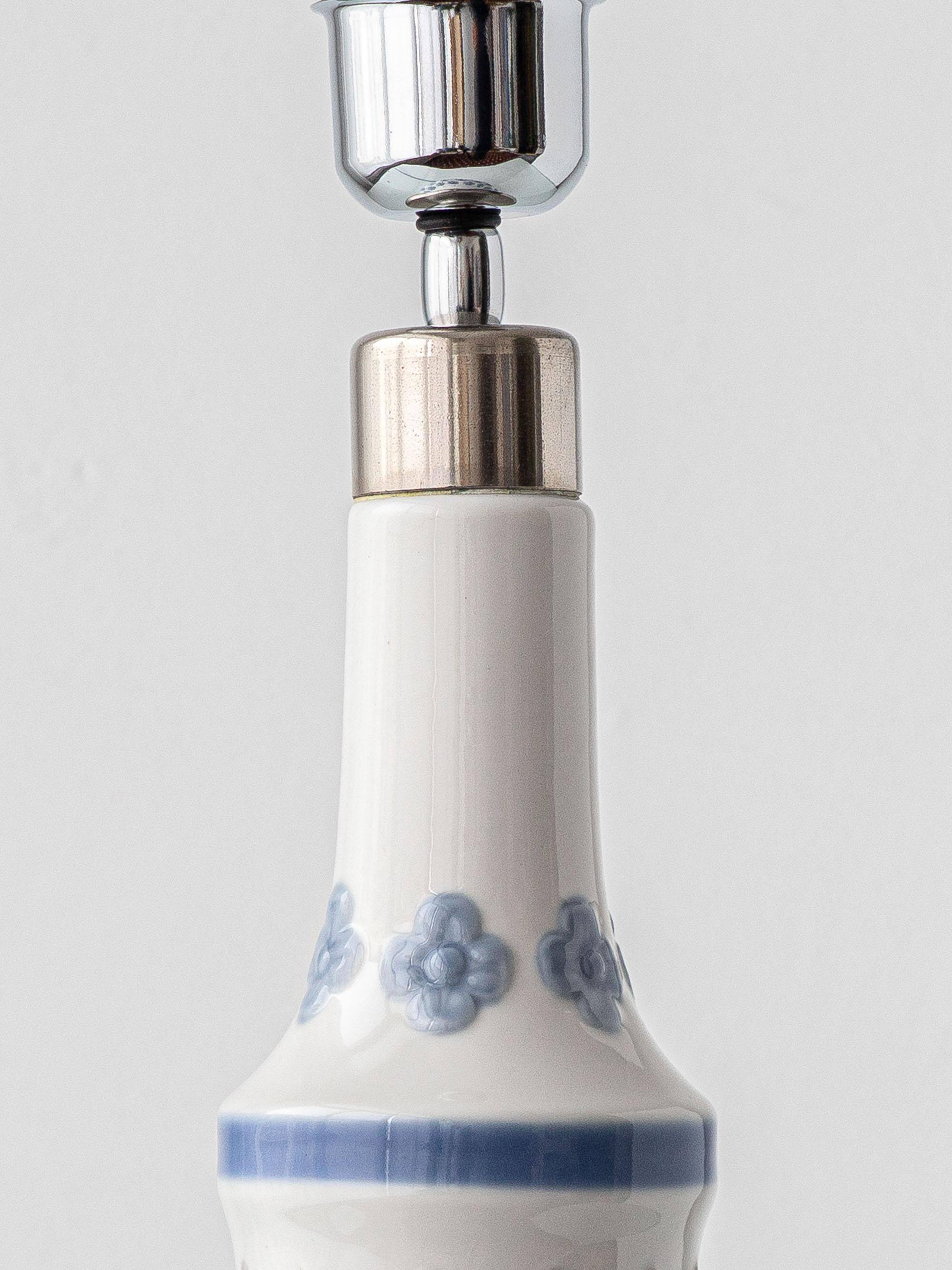 Blue and white porcelain table lamp by Lladró with floral shade in new silk.