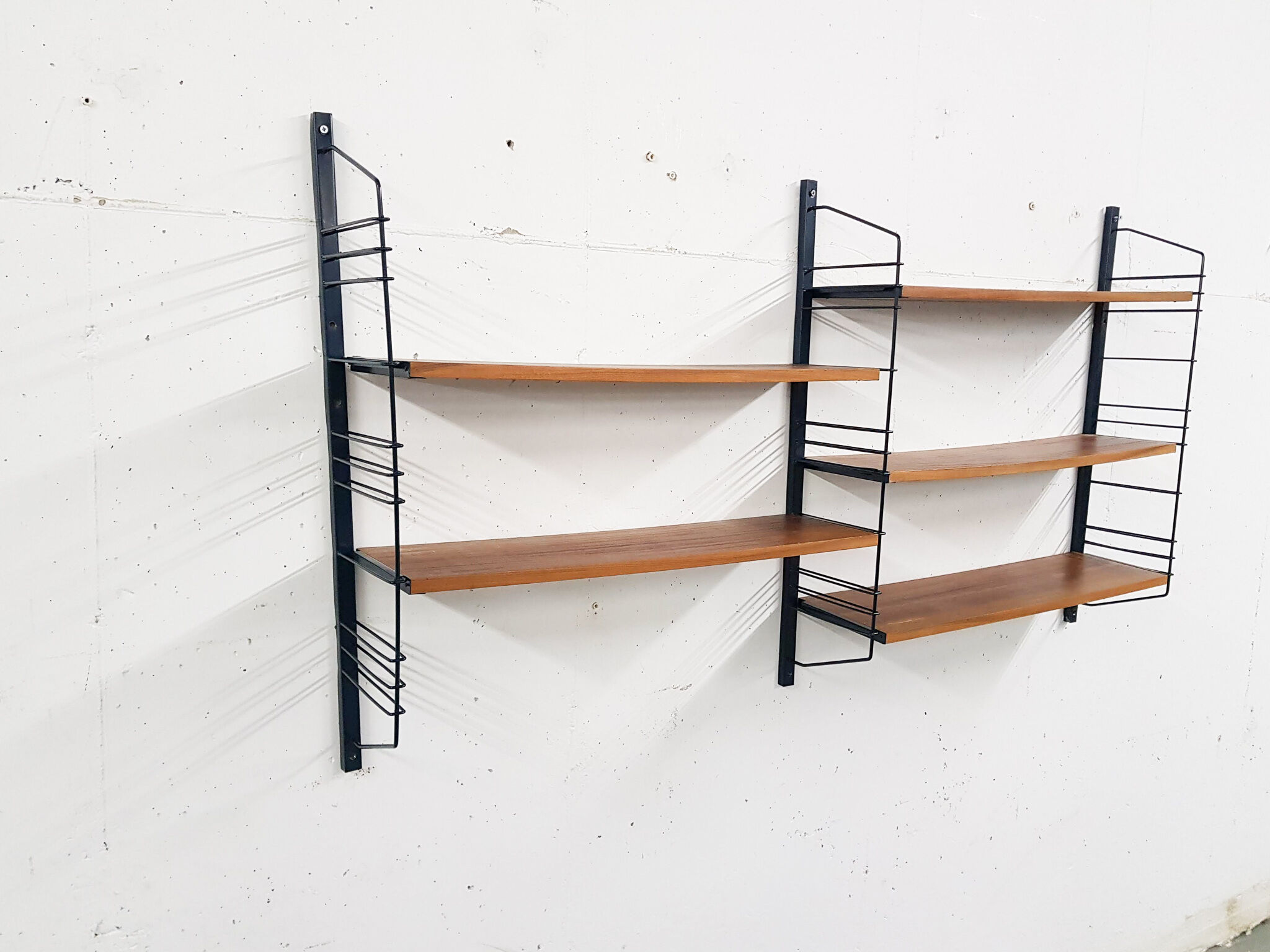 Mid-century book shelves in the style of Tomado