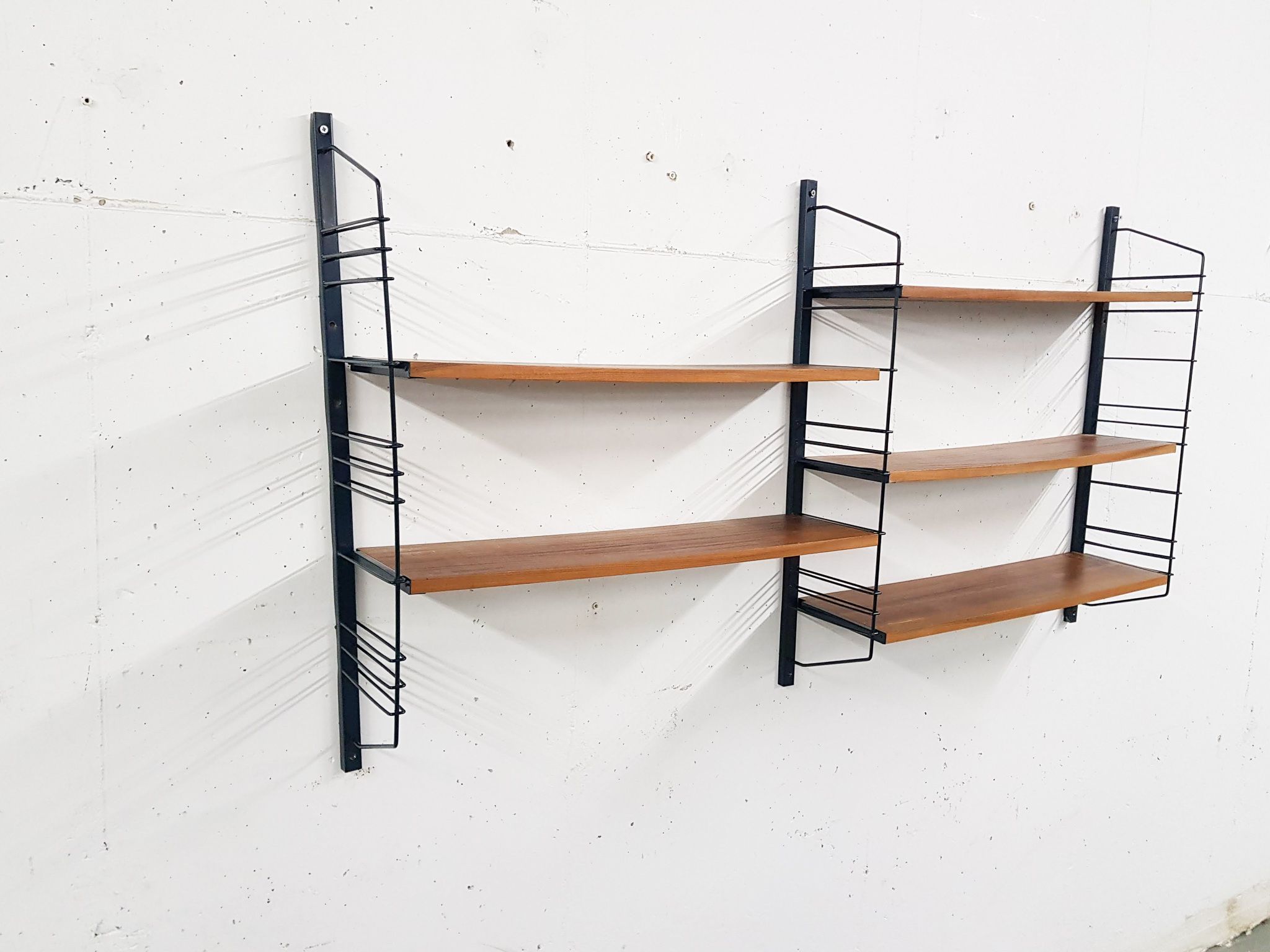 Mid-century book shelves in the style of Tomado