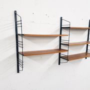 Mid-century book shelves in the style of Tomado