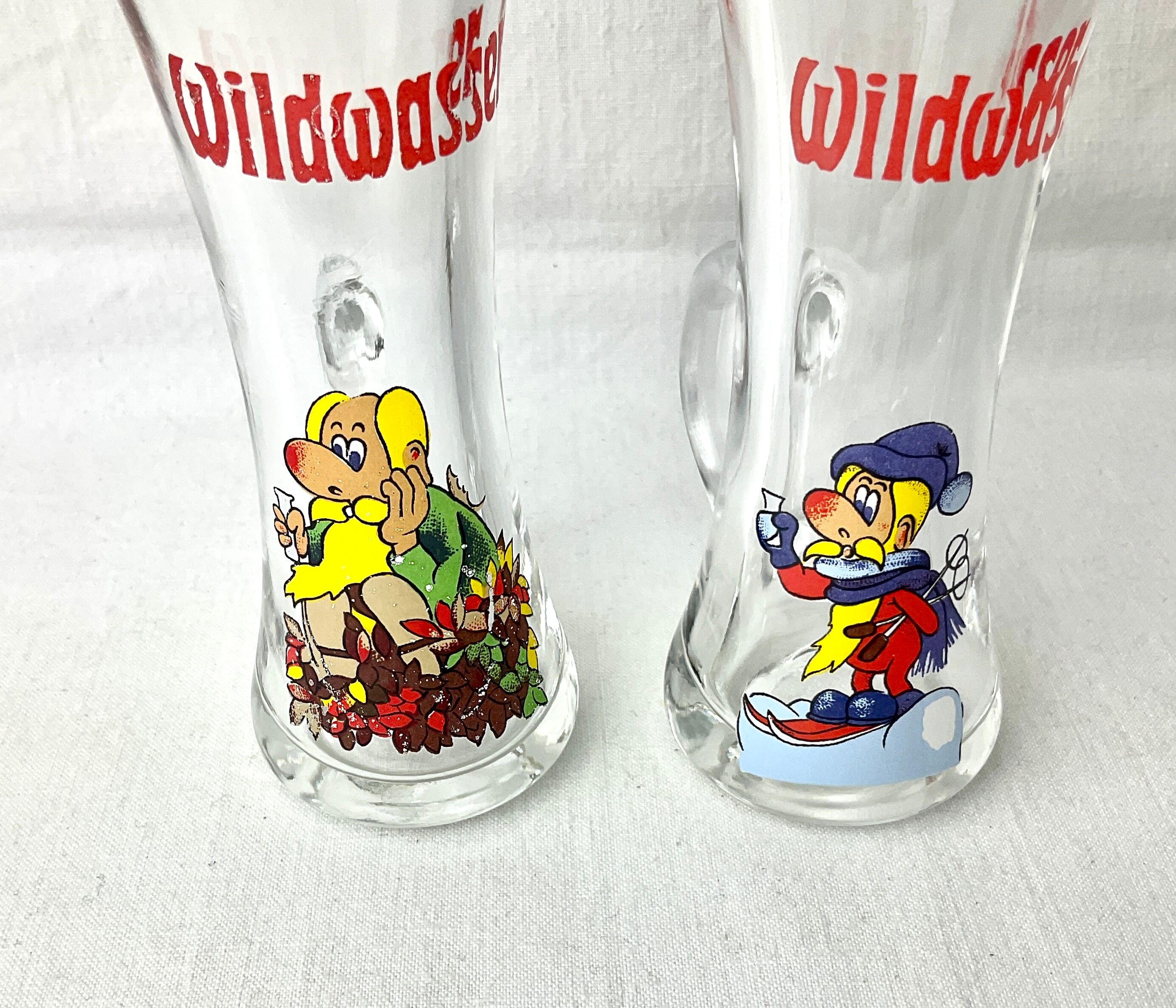Pair of vintage illustrated spirits glasses Wildwasser