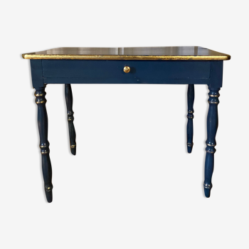 Antique lacquered table with gold leaf edges