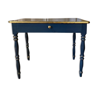 Antique lacquered table with gold leaf edges