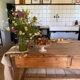Renovated raw wood farmhouse table