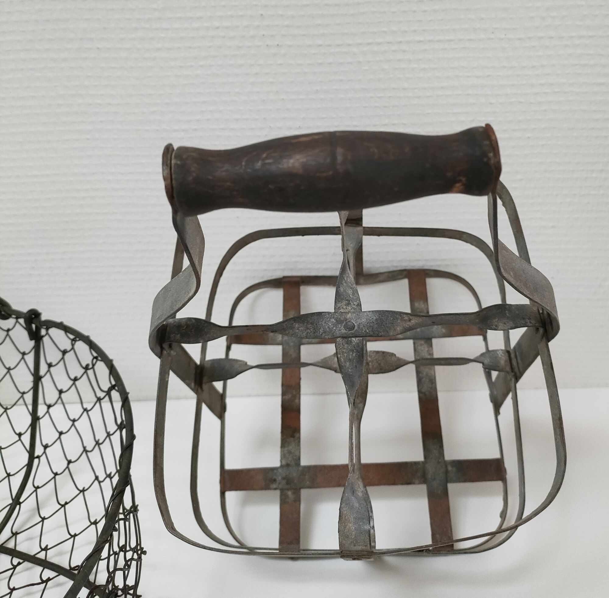 Two baskets metal and patinated wood early twentieth century