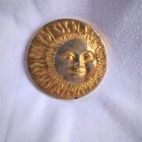 Brass sun paperweight