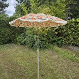 Vintage parasol in brown orange flower canvas with fringes on the edge