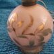 Antique lamp base with globe from the early 20th century.