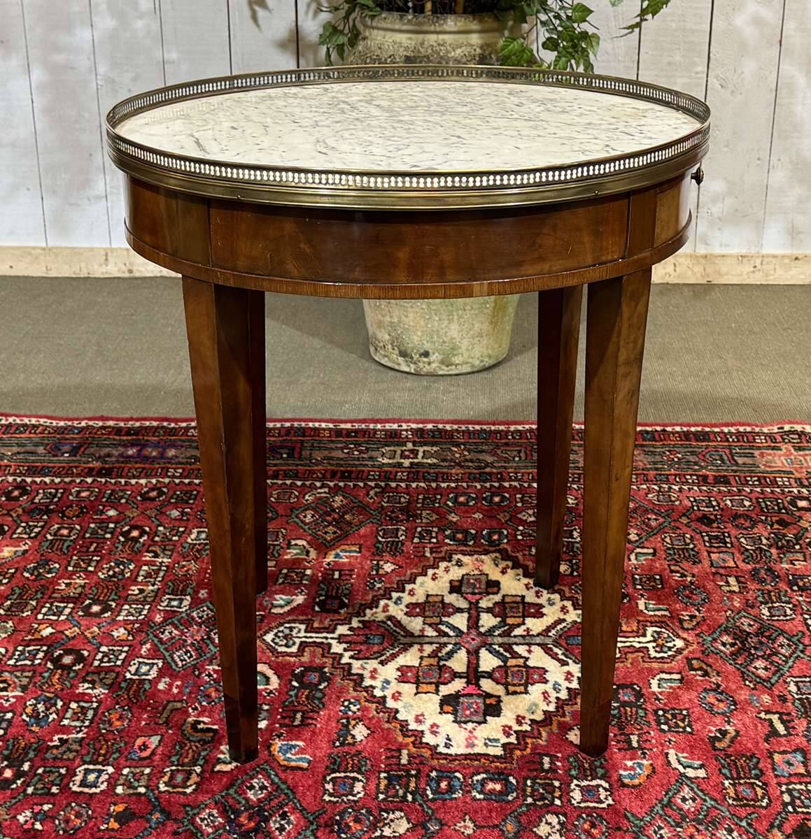 Louis XVI style bouillotte table in mahogany with a white marble top.