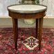 Louis XVI style bouillotte table in mahogany with a white marble top.