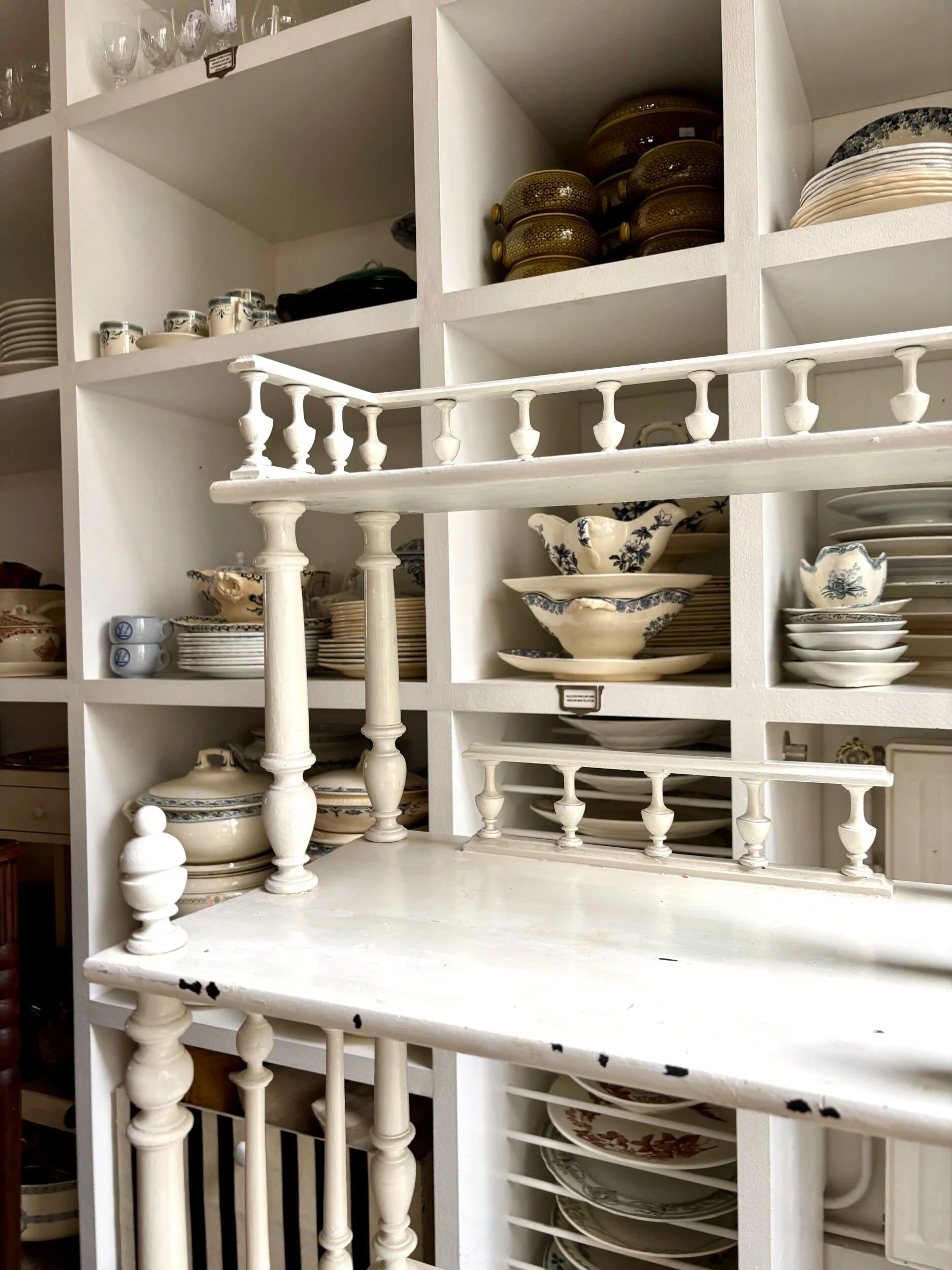 Library, white wooden sheet music cabinet.