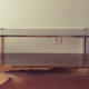 Table basse vintage dorée et verre fumé Rochebobois années 80