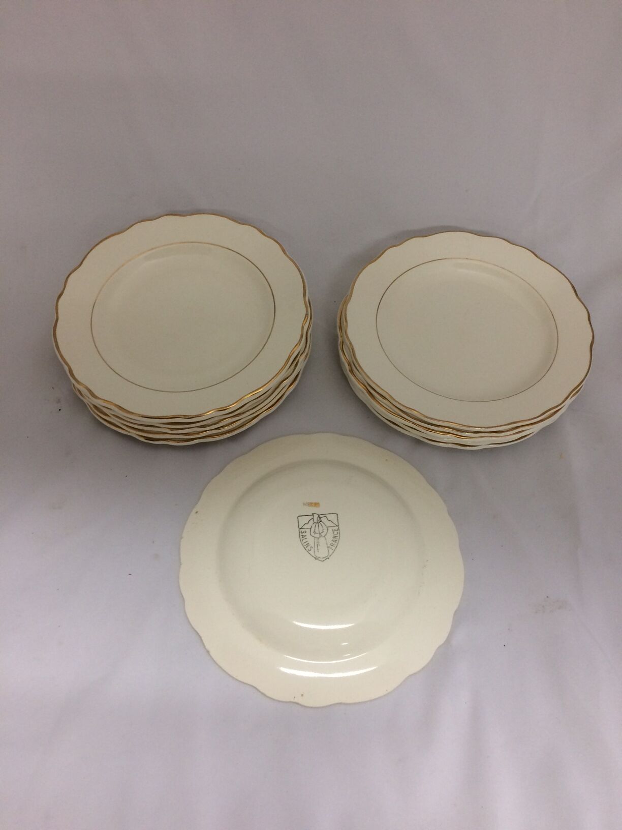 Old dessert plates in salins France earthenware