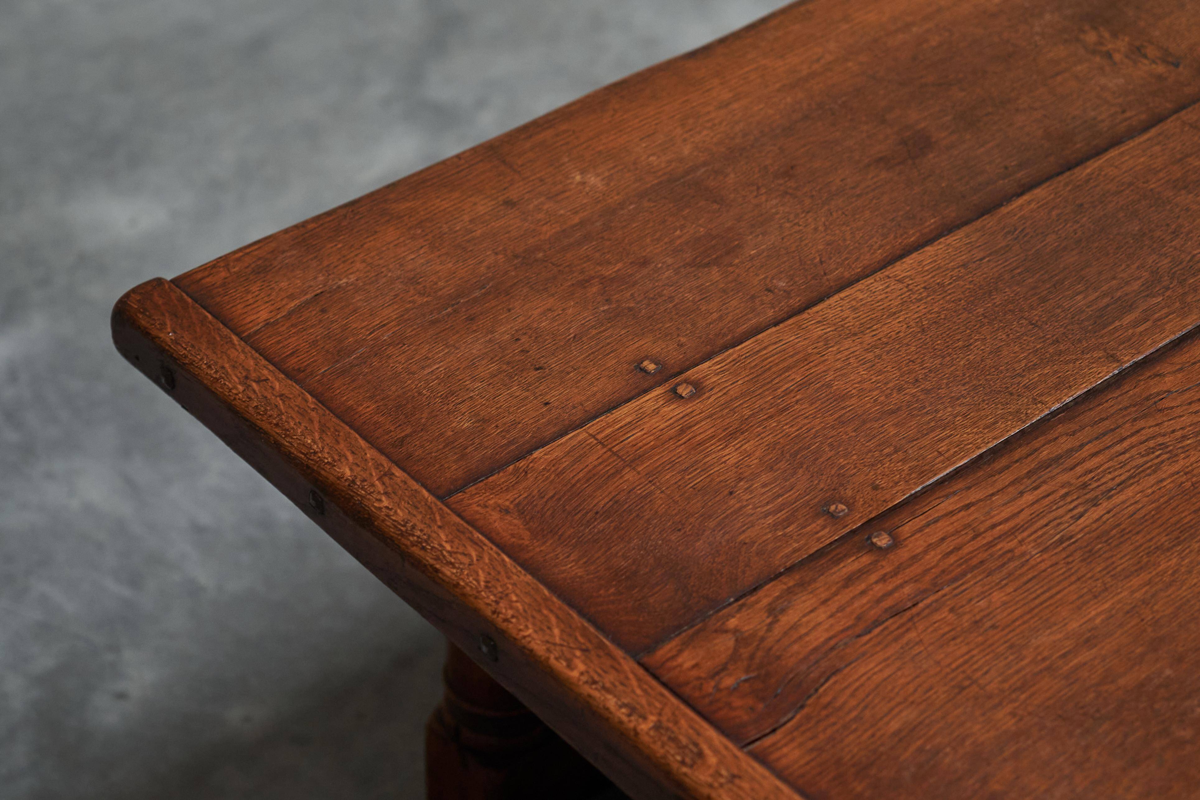 Antique solid oak coffee table in refectory style, 19th century.