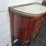 curved mahogany chest of drawers with marble top