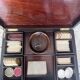 Antique Boston game box from the 19th century - marquetry, tokens, and handwritten rules.