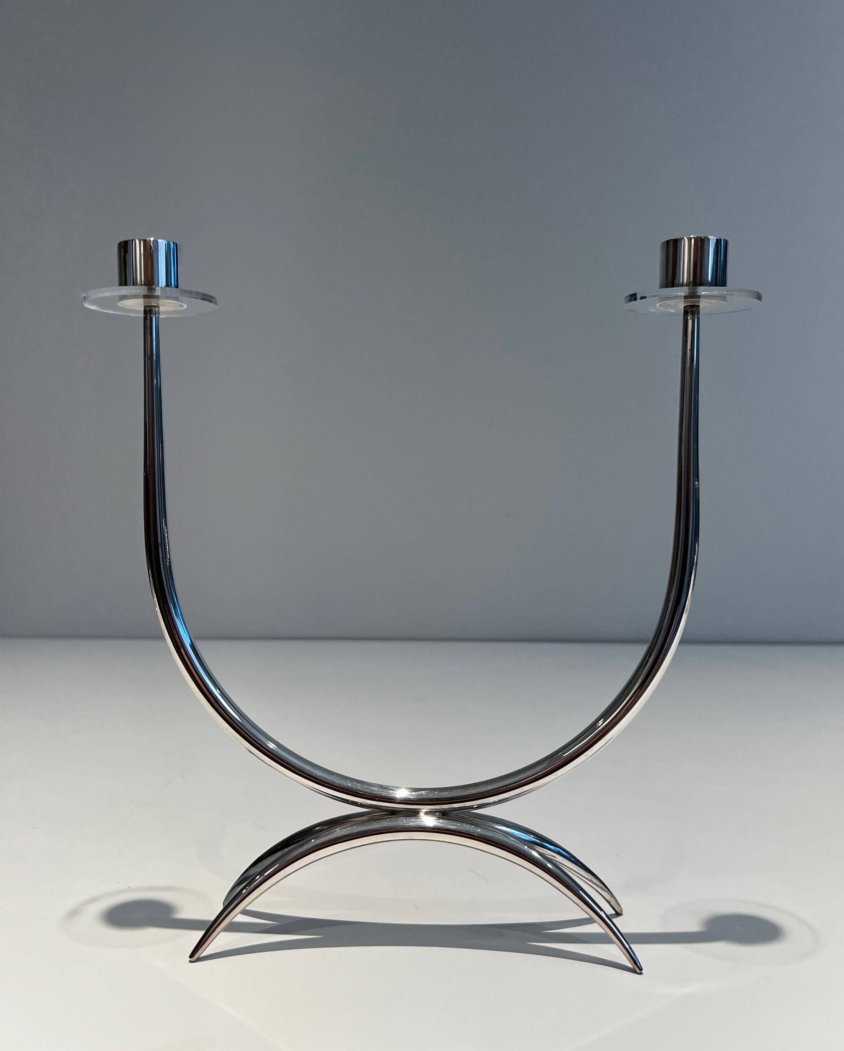 Silver-plated metal and plexiglass design candlestick.