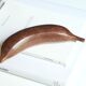 Wooden banana paperweight, 70s