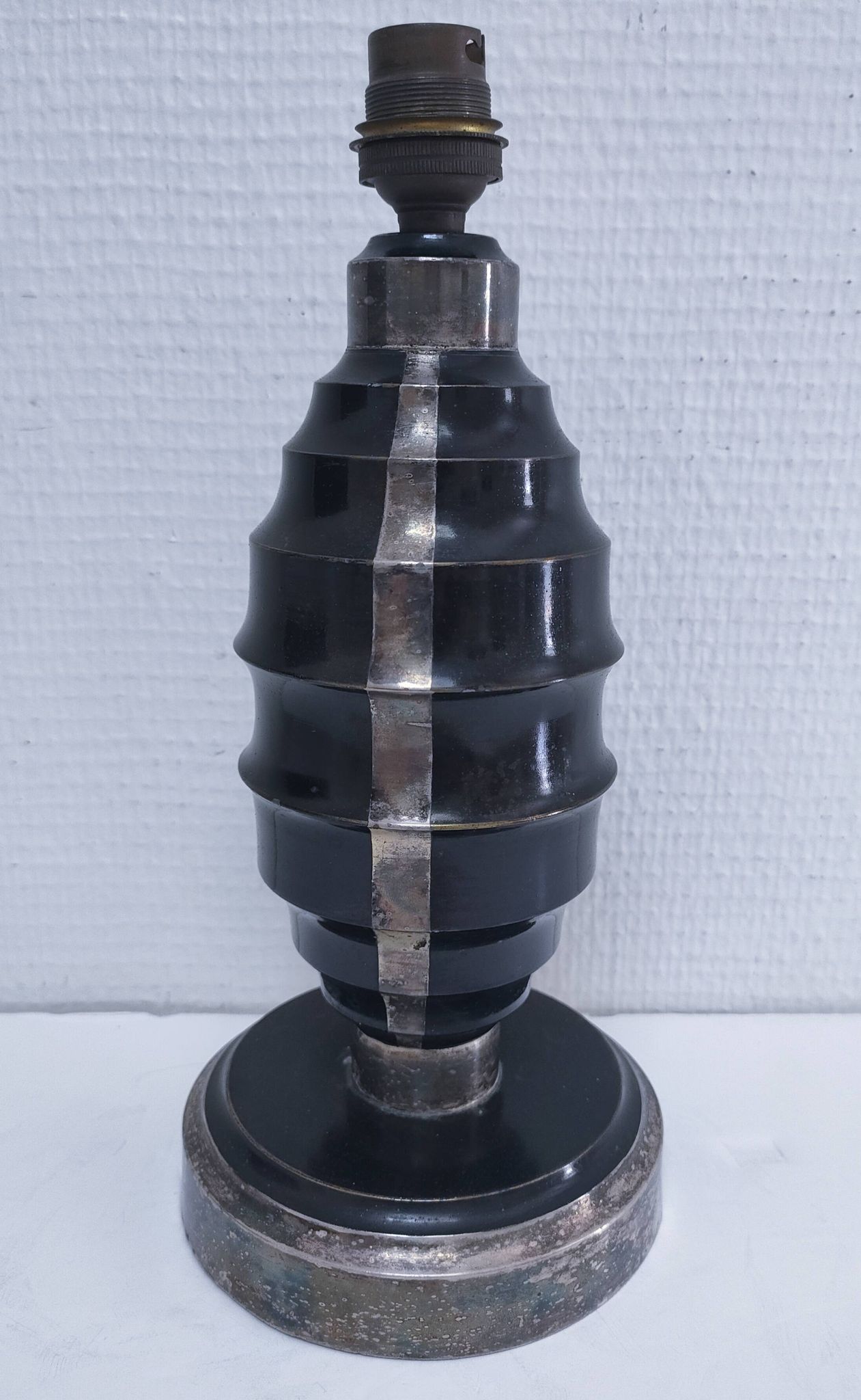 Art Deco metal lamp base with black and silver patina