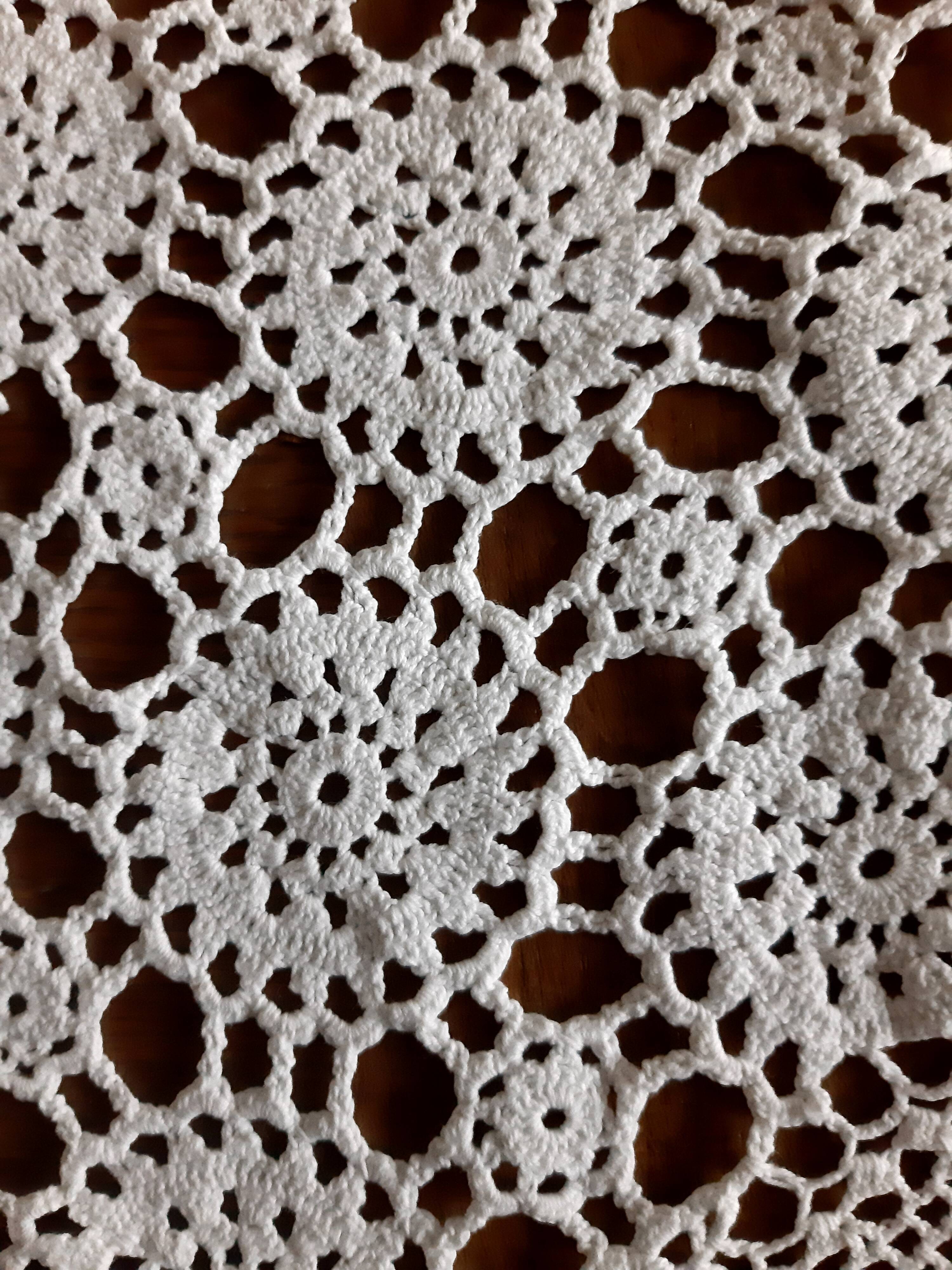 Old crocheted round tablecloth
