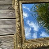 Miroir en bois et stuc doré