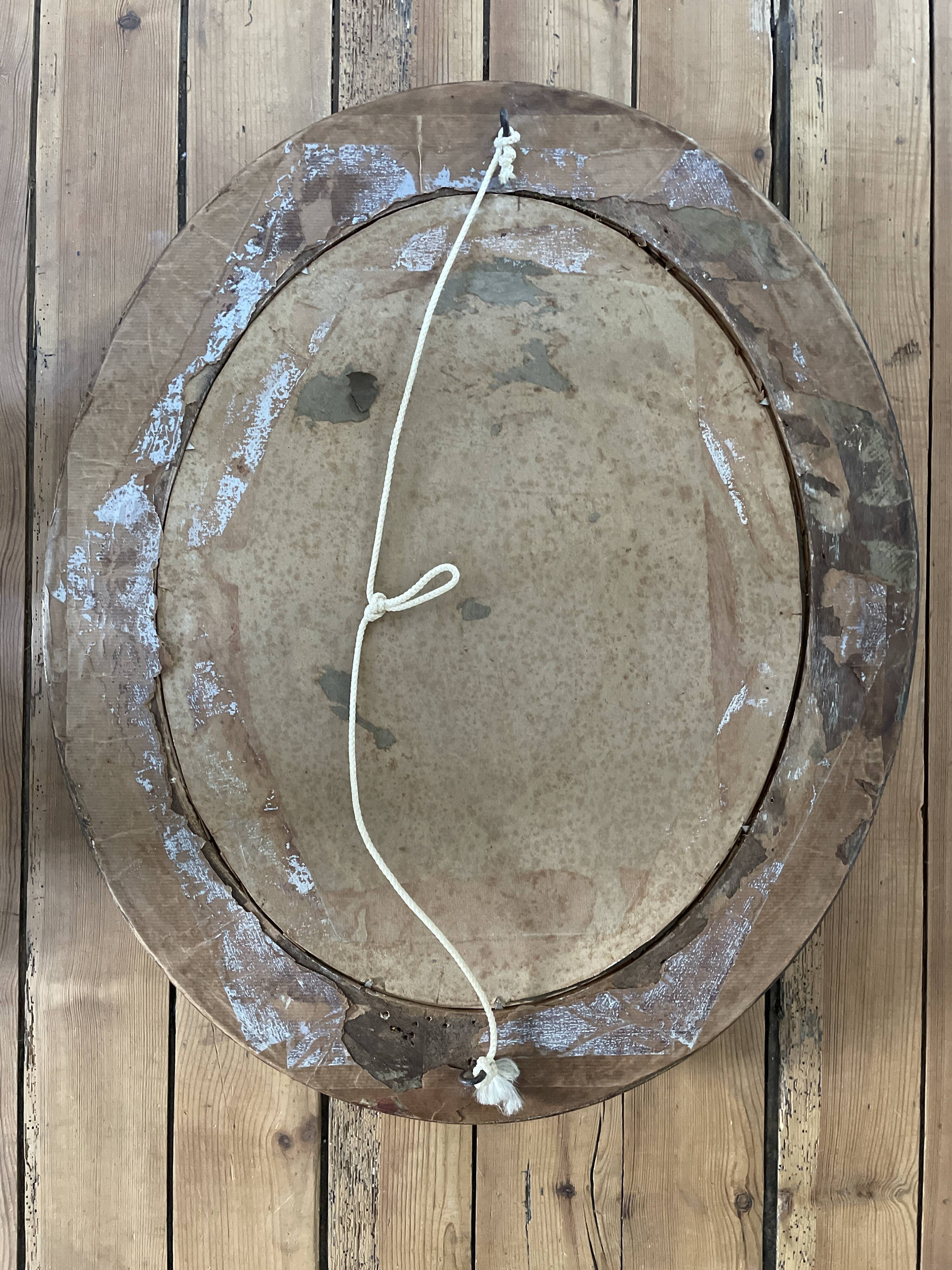 Oval frame portrait of a 19th century couple