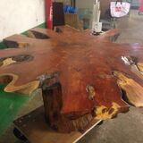 Round table carved from a wooden slice of PADOUK