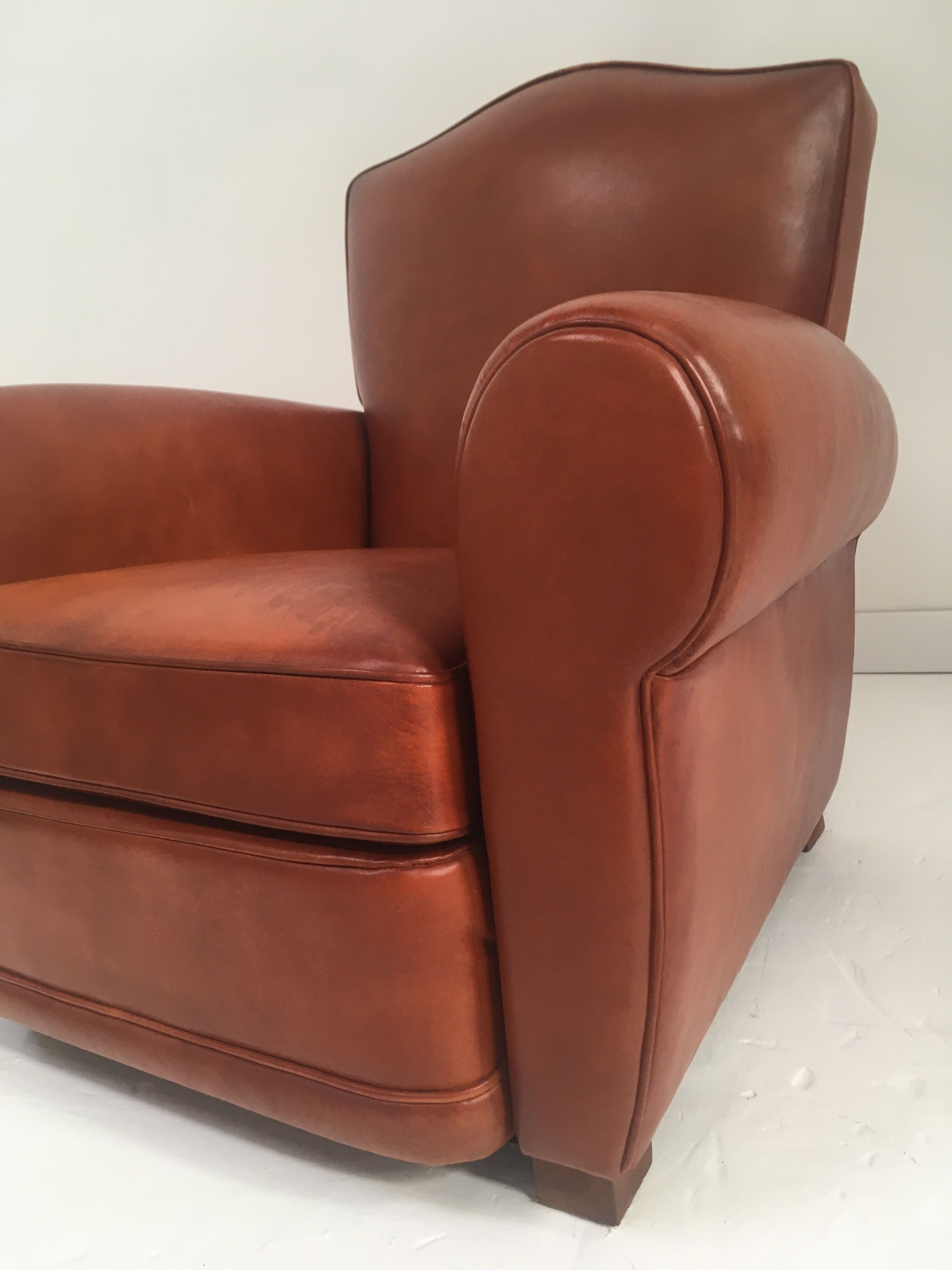 Large club chair in cognac leather