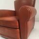 Large club chair in cognac leather