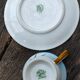 Tasse et sa soucoupe en porcelaine de Limoges motif "hirondelles"