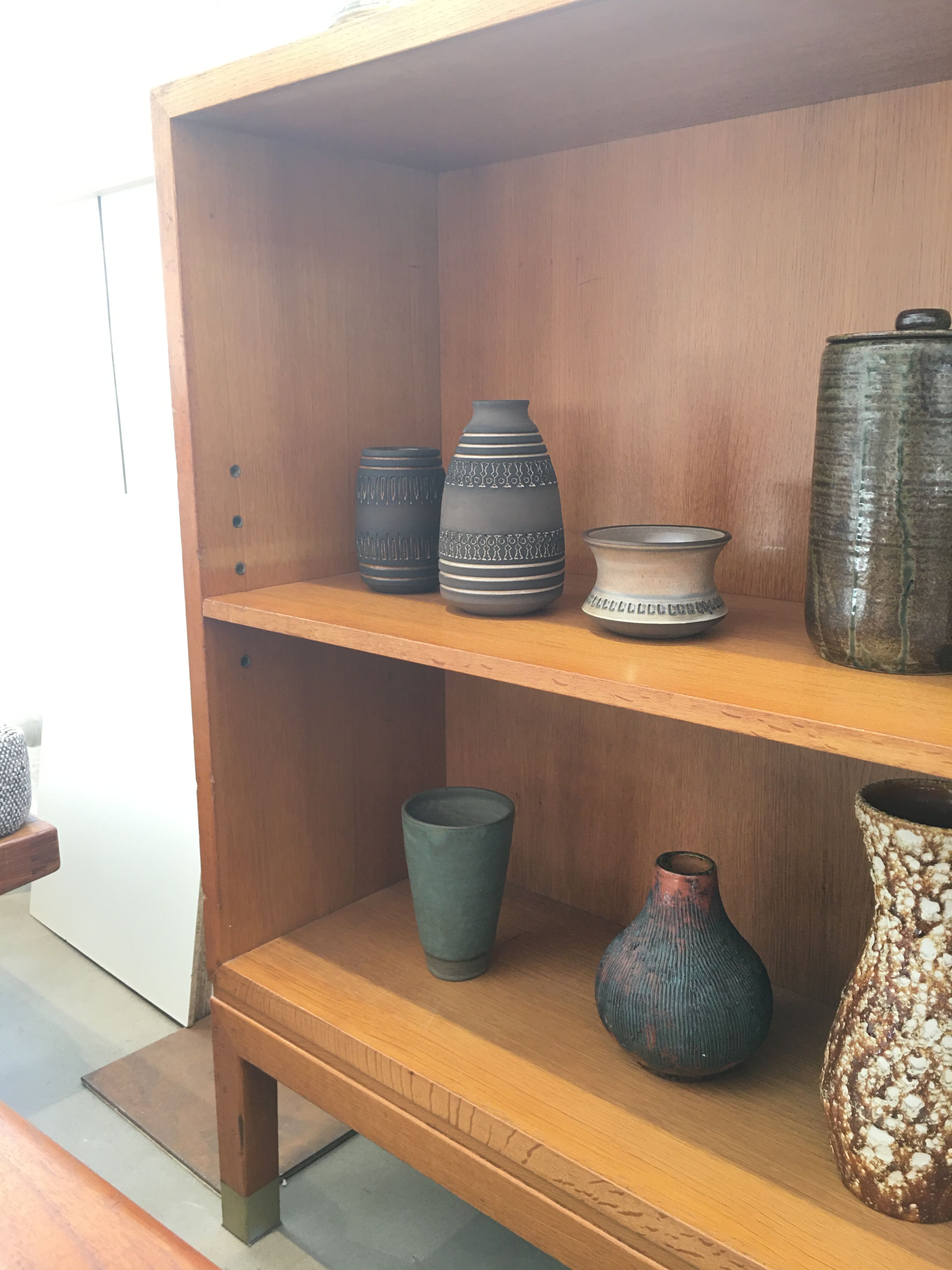 Oak bookcase with brass clogs, 60's