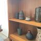 Oak bookcase with brass clogs, 60's