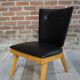 Cocktail armchair of the 50s in wood and black imitation