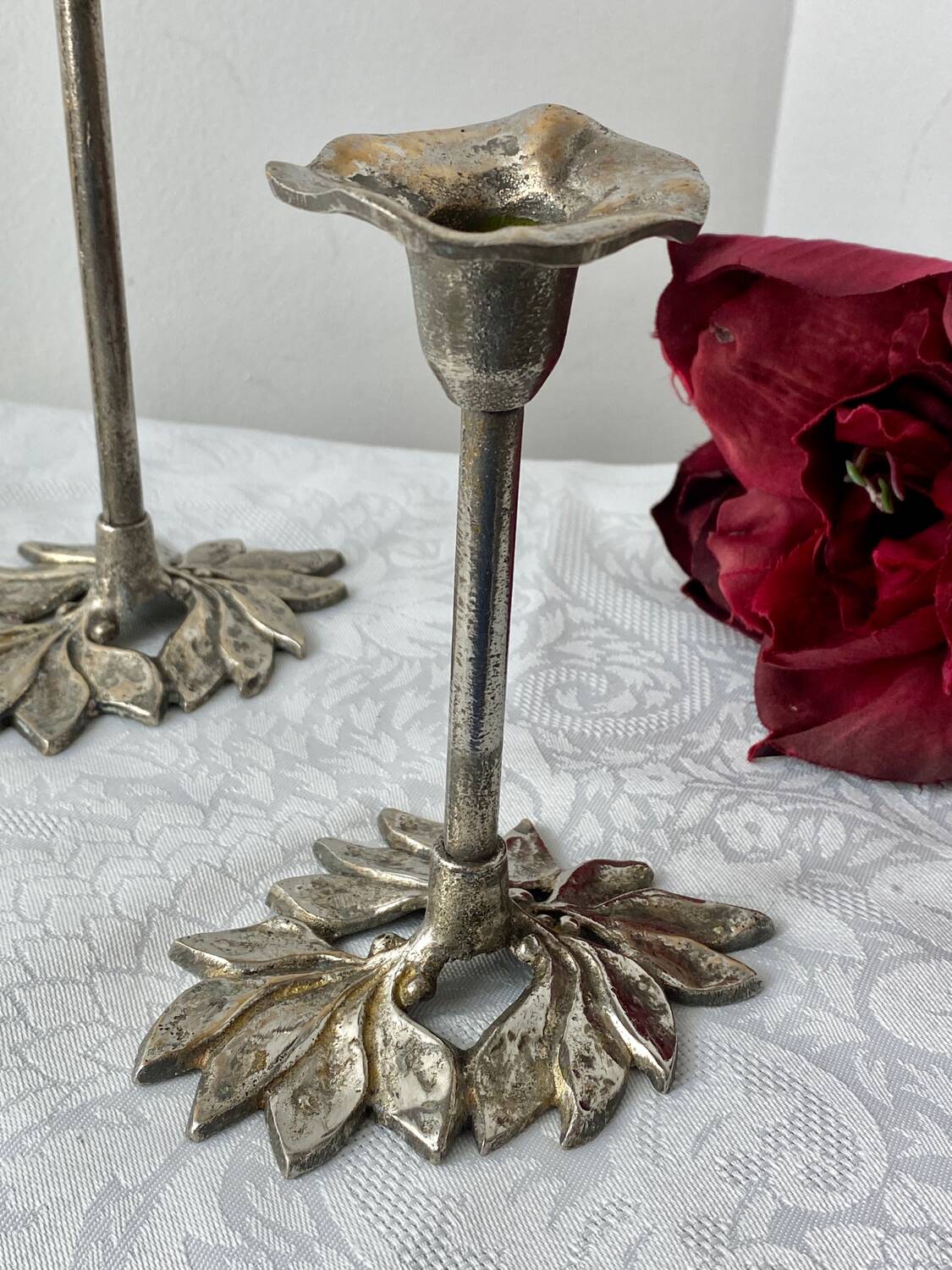 Pair of metal flower candlesticks