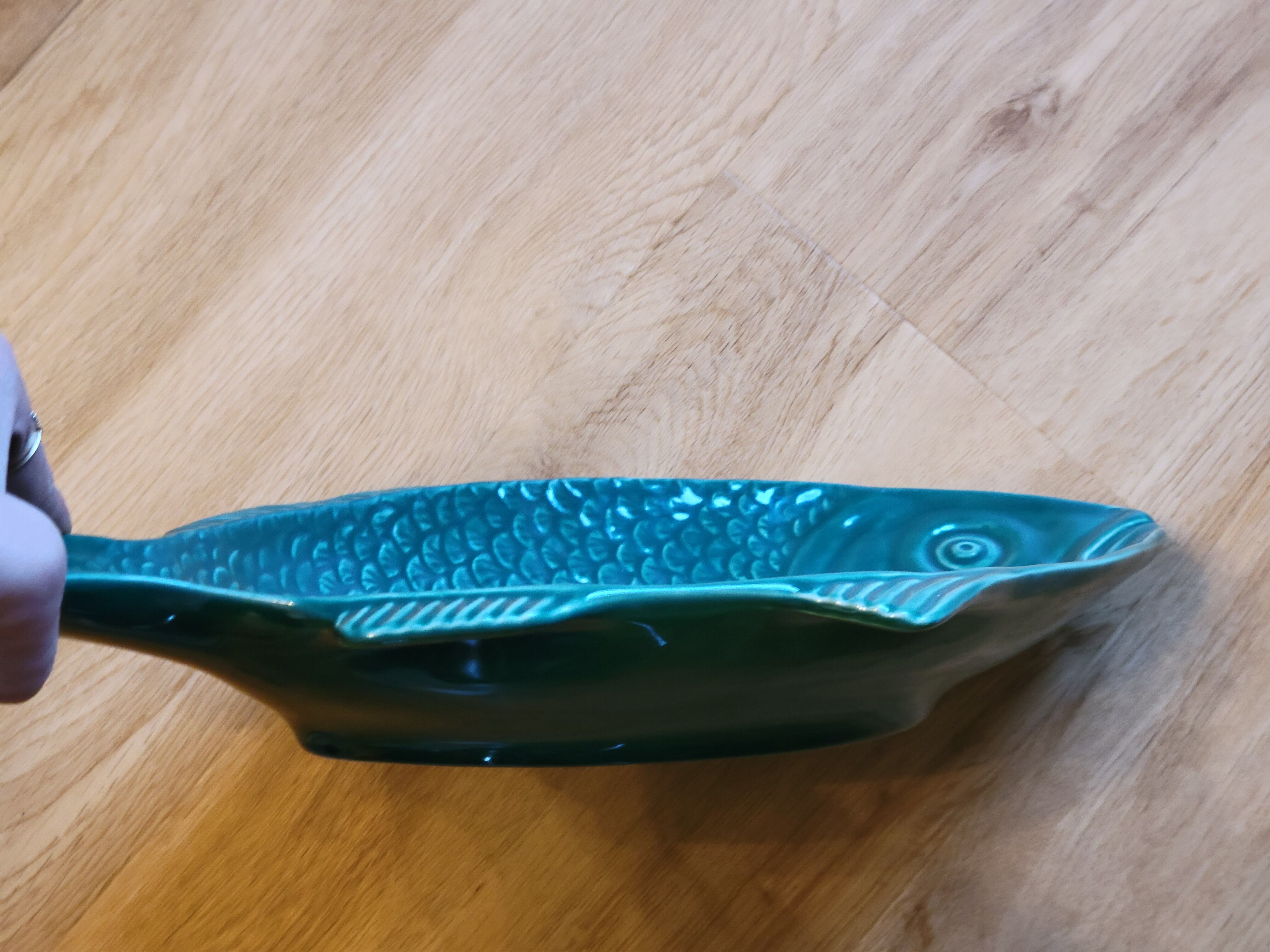 Ceramic serving flat plate in the shape of green fish