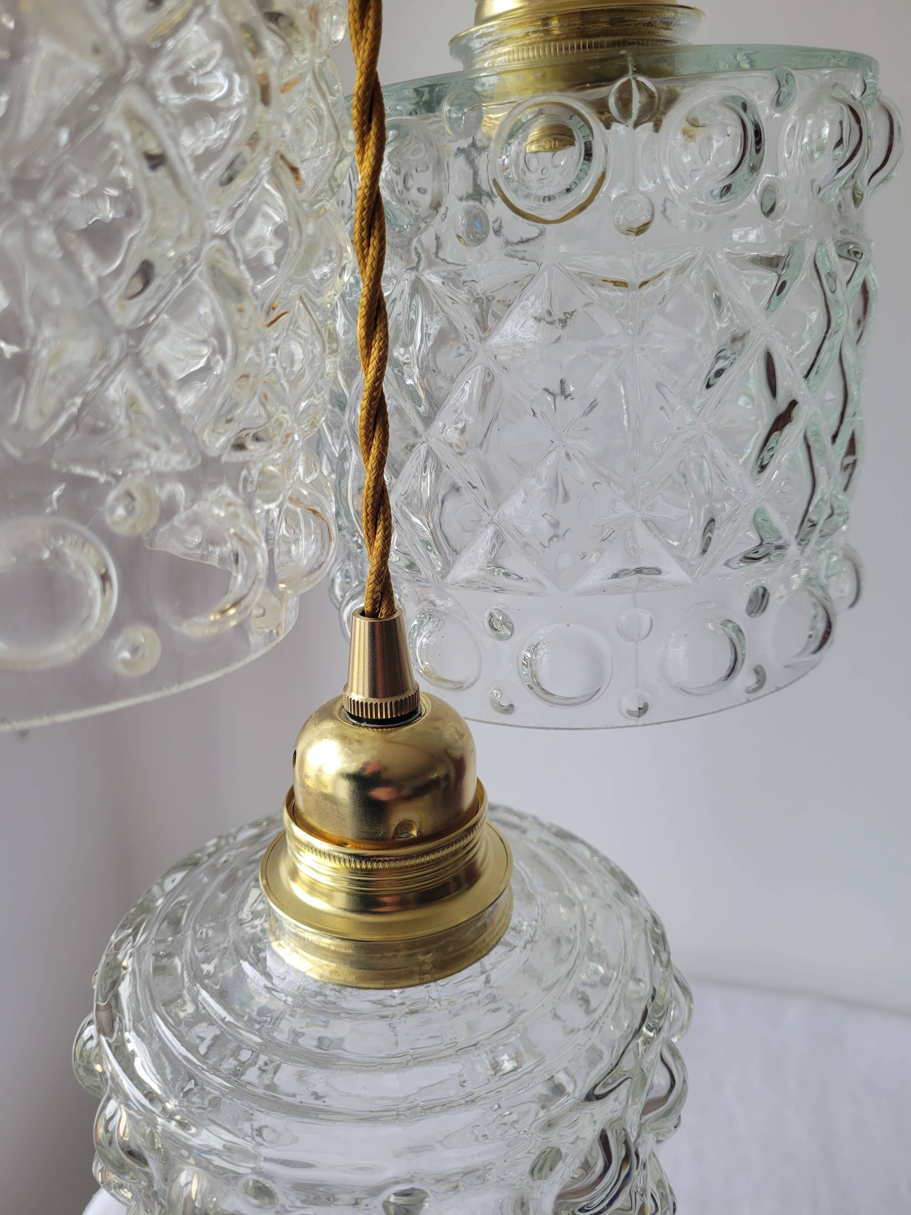 Trio of molded glass pendant lights