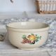 Vintage round earthenware salad bowl with fruit pattern