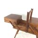 Worker on wooden compass feet
