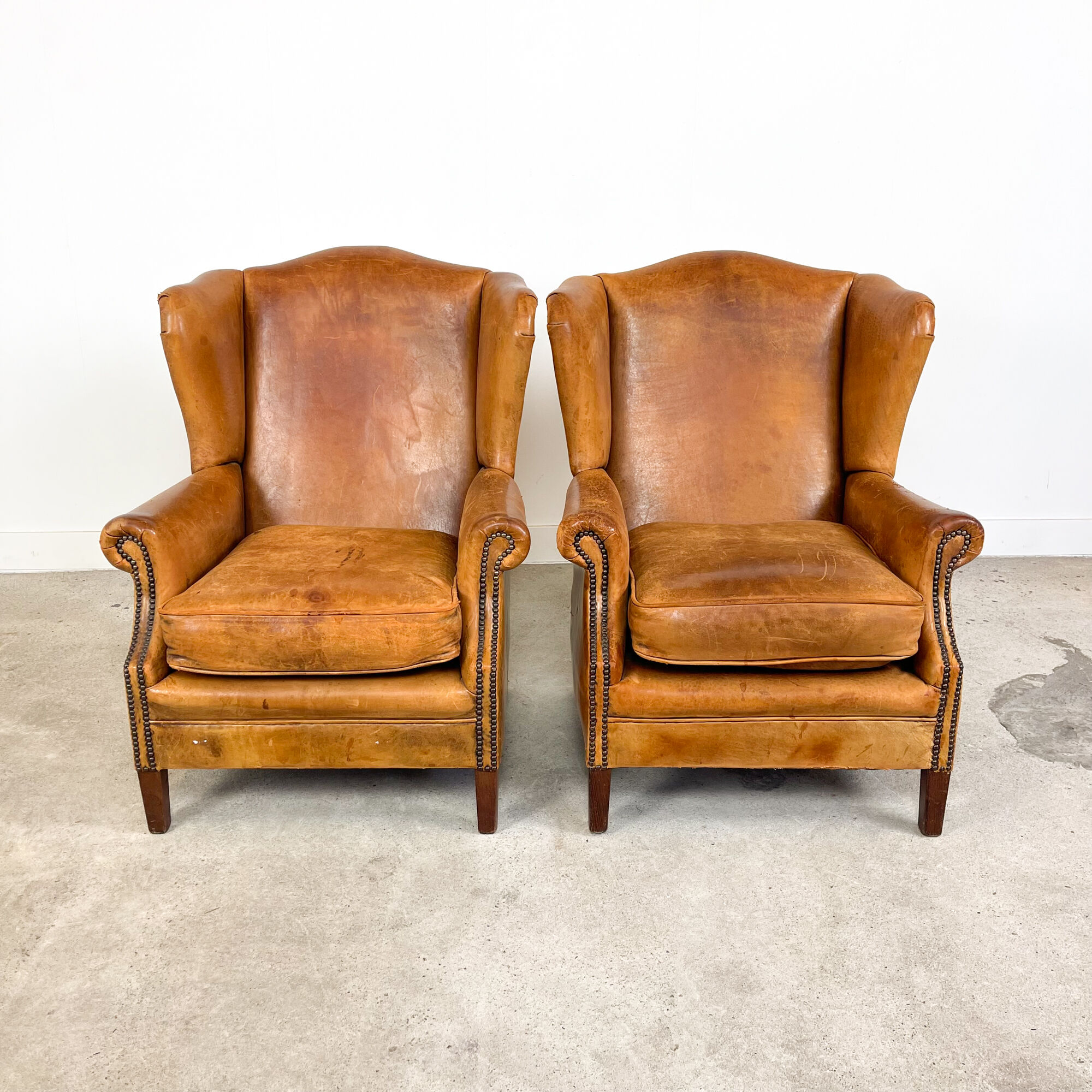 Set of two sheep leather wingback armchairs Delft