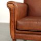 Sturdy vintage sheepskin armchair with a beautiful cognac colour