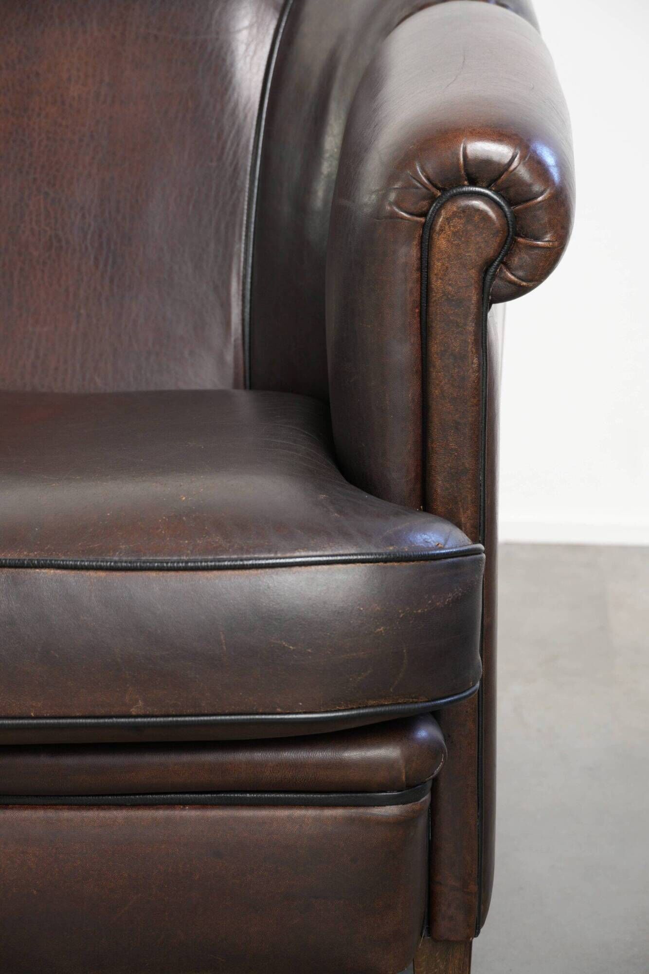 Set of a sheepskin sofa together with its matching club armchair