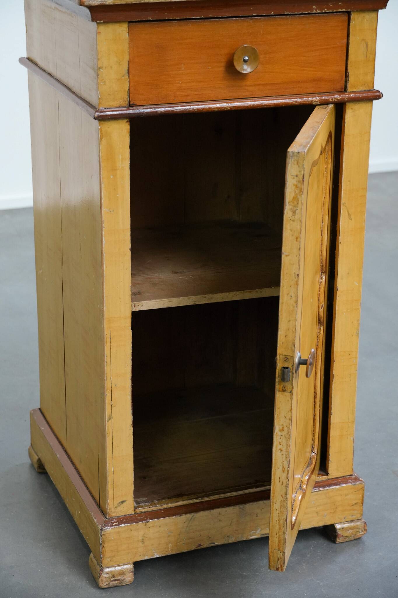Antique wooden 1-door hallway/nightstand with a light marble top