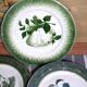 Antique earthenware plates with fruit decoration.