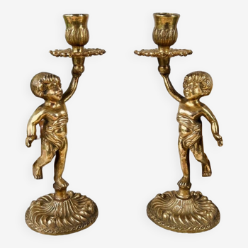 Pair of bronze “Cherubim” candlesticks