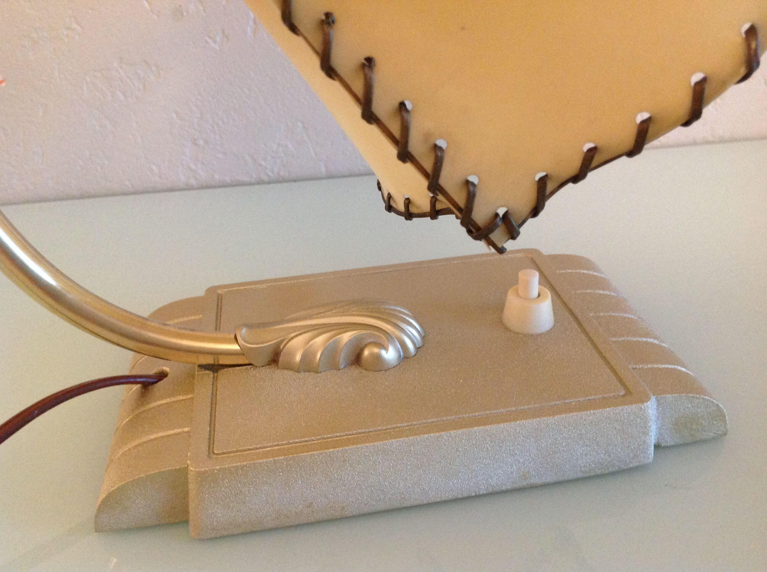 Brass bedside lamp and beige lampshade art deco style