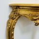 Golden console in Louis XV Rococo style made of resin.