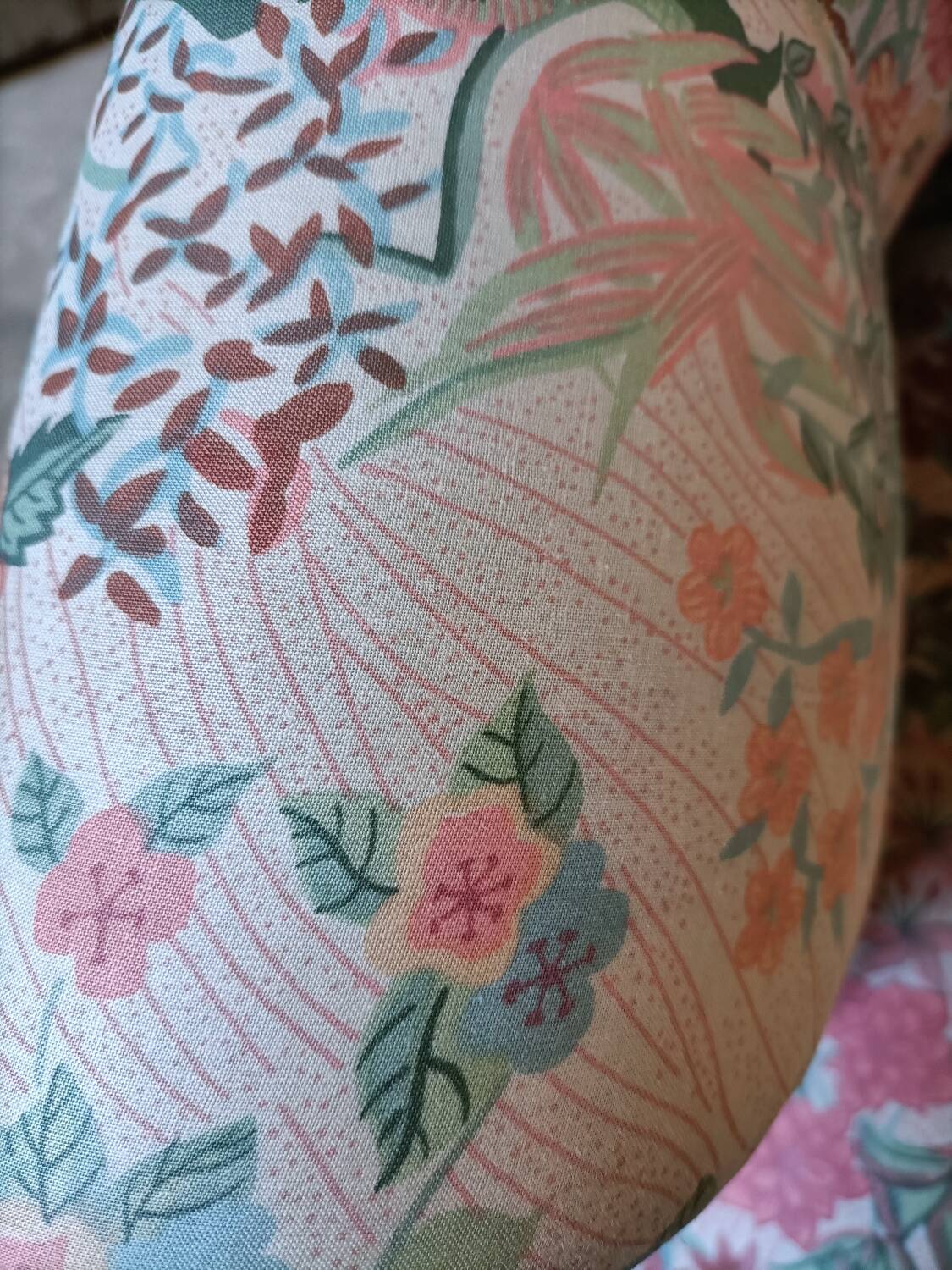 pair of toad armchairs in floral fabric.