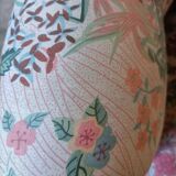 pair of toad armchairs in floral fabric.