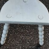 Duo of milking stools with turned legs.