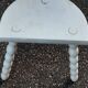 Duo of milking stools with turned legs.
